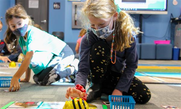 Girl uses BeeBot